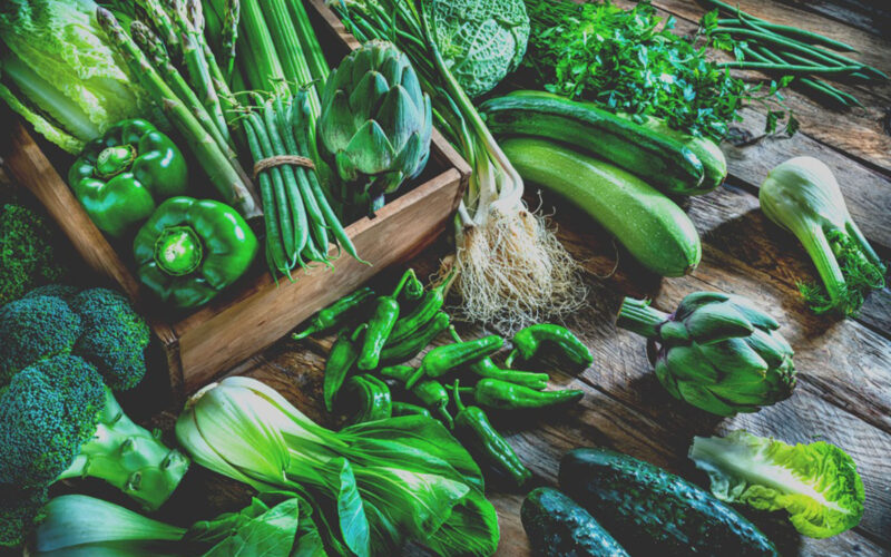 winter vegetables in basket on a wood table