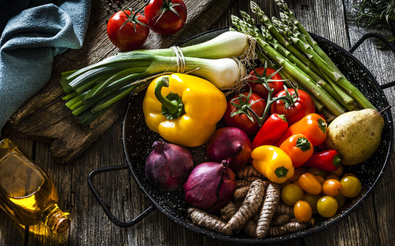 summer vegetables in bowl on a wood table